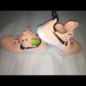 peach colored nike sneakers